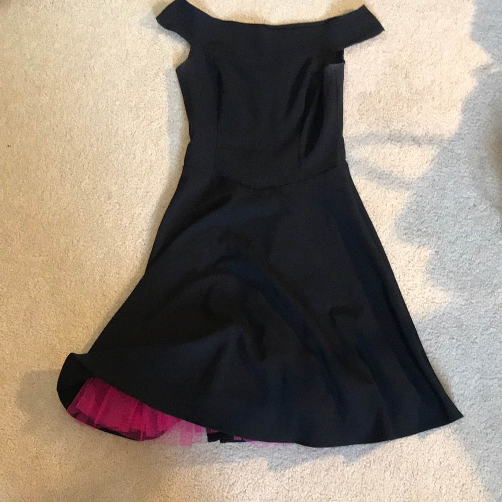Black dress with surprise pink tool